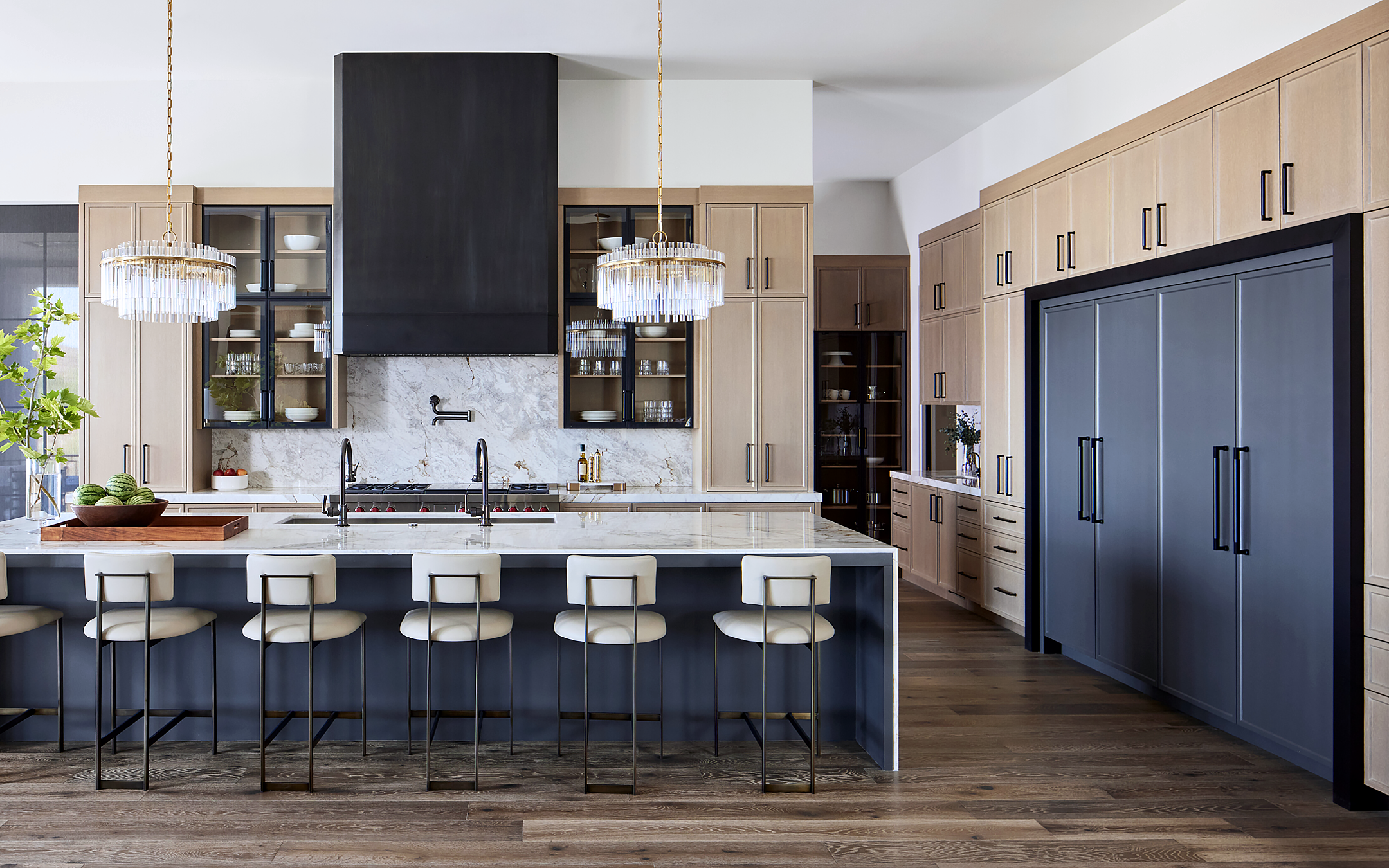 Seamless kitchen design with Sub-Zero refrigerator inside the cabinet